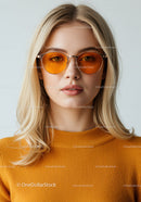Stylish Woman in Orange Sunglasses and Sweater for Modern Fashion