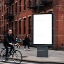 Urban street scene with blank advertisement billboard