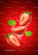 Fresh strawberry halves with mint leaves and water splash