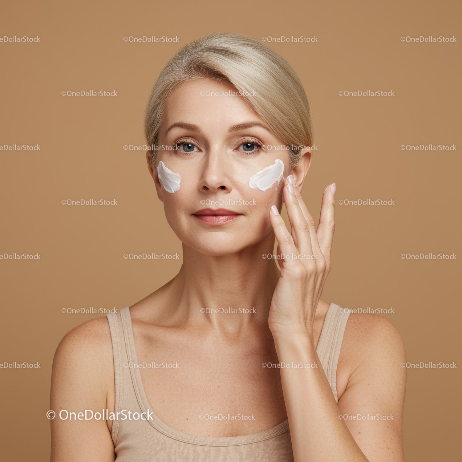 Beautiful Woman with Clear Skin Applying Face Cream for Skin Care