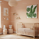Cute Baby Nursery with Green Monstera Leaf Wall Art and Plush Decor