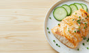 Grilled Salmon with Cucumber Slices on White Plate in Fresh Setting