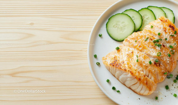 Grilled Salmon with Cucumber Slices on White Plate in Fresh Setting