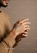 Close-Up of Man Applying Skin Moisturizer with Lotion on Hand