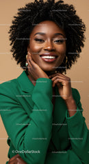 Elegant African American Woman Smiling in Green Suit And Gold Jewelry
