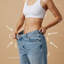 Woman Measuring Waist in Casual Blue Jeans and White Sports Bra
