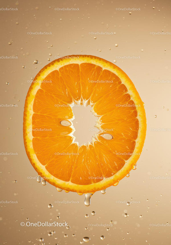 Fresh Orange Slice with Water Droplets Close Up