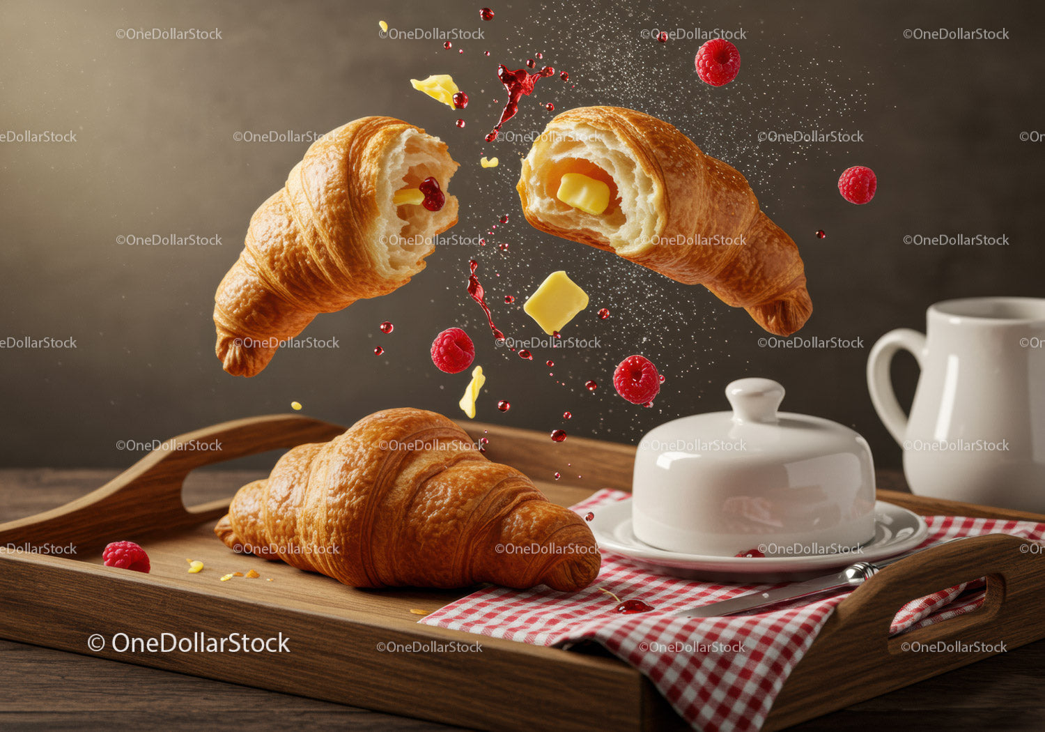 Fresh croissants with butter and raspberries on tray