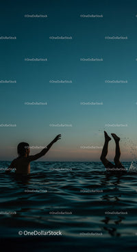 Playful Moments in the Water at Sunset