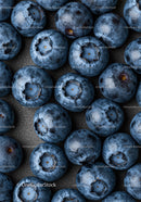 Close Up of Fresh Ripe Blueberries on Dark Surface