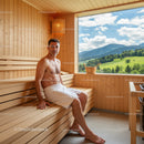 Relaxing Man in Wooden Sauna with Mountain View During Wellness Session
