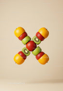 Creative arrangement of mixed fresh fruit slices crossing