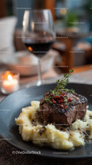 Gourmet Beef Steak with Mashed Potatoes and Rosemary Garnish