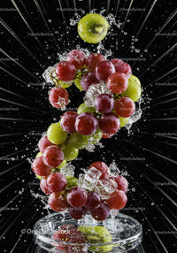 Fresh grapes and kiwi splashing into water with ice