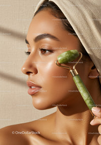 Portrait of a Woman Using Jade Roller for Skin Rejuvenation