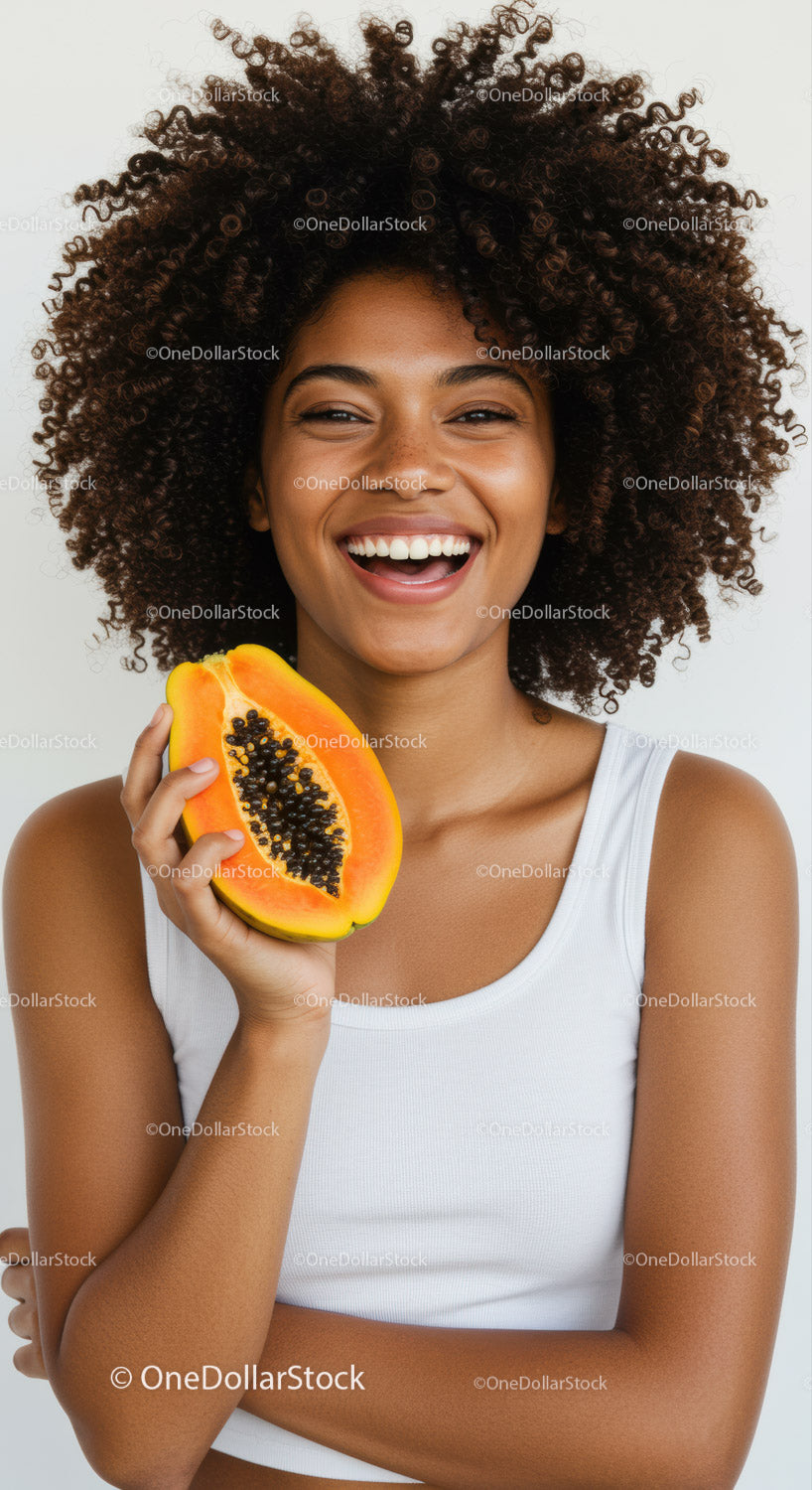 Happy Woman Holding Fresh Papaya with Bright Smile and Curly Hair