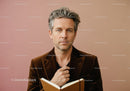 Elegant Mature Man Reading a Book in Stylish Outfit