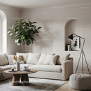 Cozy beige living room with modern decor and greenery