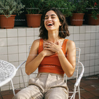 Joyful Woman Laughing in a Bright Outdoor Setting