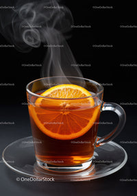 Steaming hot tea with fresh orange slice in glass