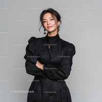 Elegant Woman in Black Dress with Confident Pose
