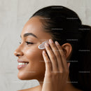 Elegant Woman Applying Facial Cream - Beauty and Skincare Concept
