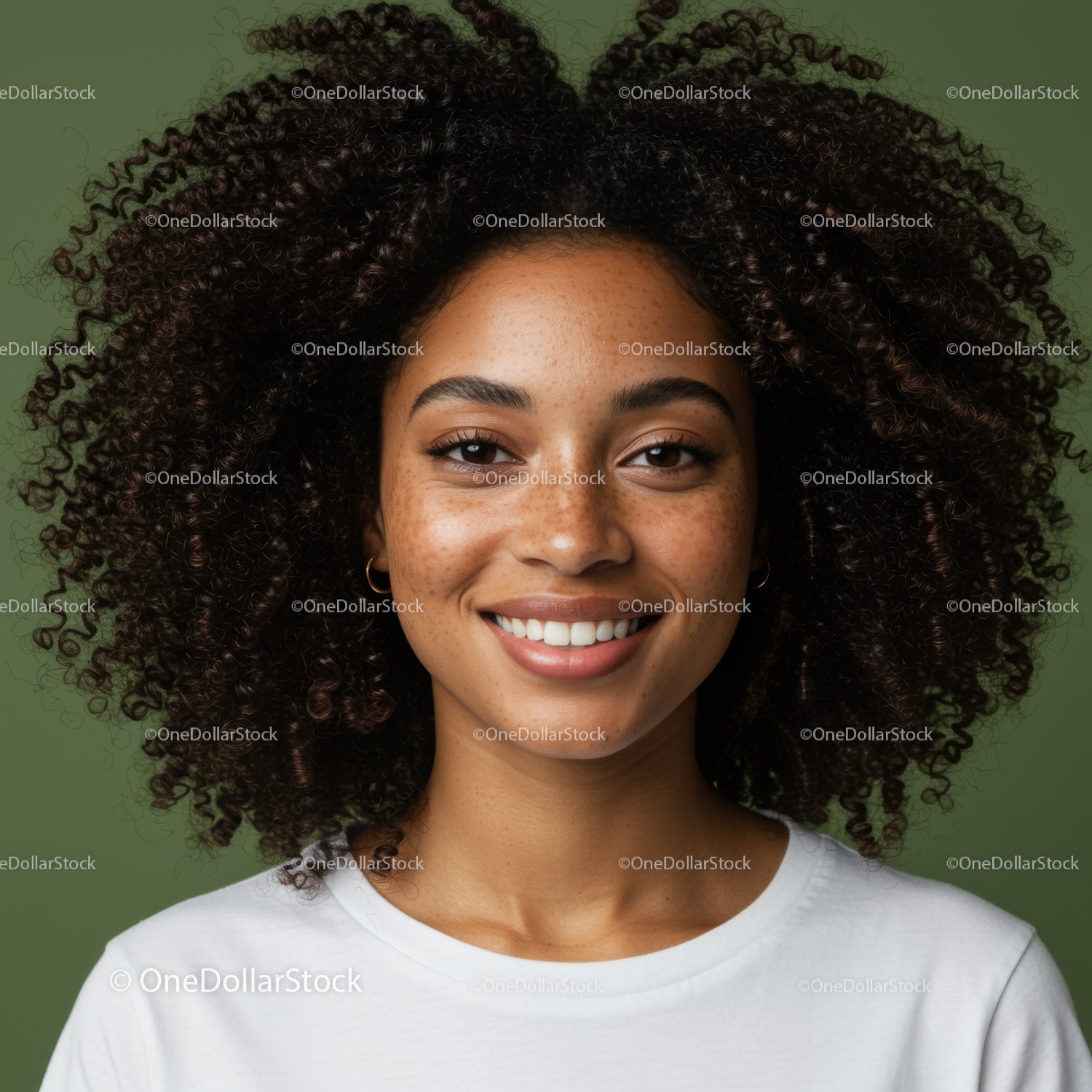 Smiling Woman with Curly Hair and Freckles in Bright Indoor Setting