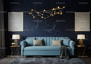 Modern living room with celestial wall decor and blue sofa