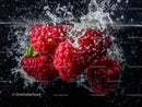Vibrant Ripe Raspberries Splashing in Water