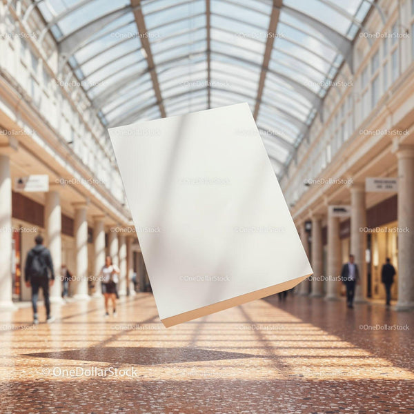 Blank white flyer floating in bright shopping mall corridor JPG Mockup Image