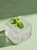 Fresh mint leaves on a clear ice cube