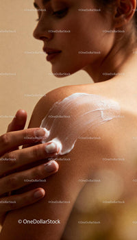 Woman Applying Cream to Her Shoulder with Gentle Touch