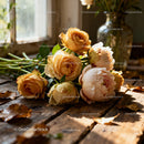 Soft Dewy Roses Resting on Rustic Wooden Table