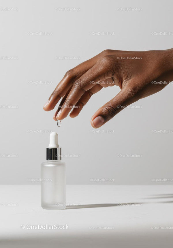 Close-up of Hand Applying Moisturizer with Dropper Bottle JPG Mockup Image