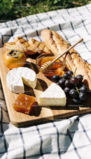 Artisan Cheese and Fresh Fruit Picnic Board on Blanket