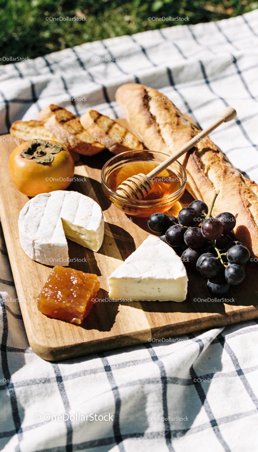 Artisan Cheese and Fresh Fruit Picnic Board on Blanket