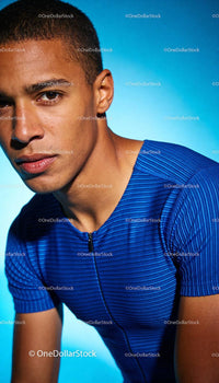 Focused young male athlete in blue sportswear