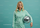 Young Woman in Mint Green Tracksuit Holding Disco Ball in Studio