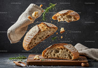Rustic sliced sourdough bread with rosemary and salt