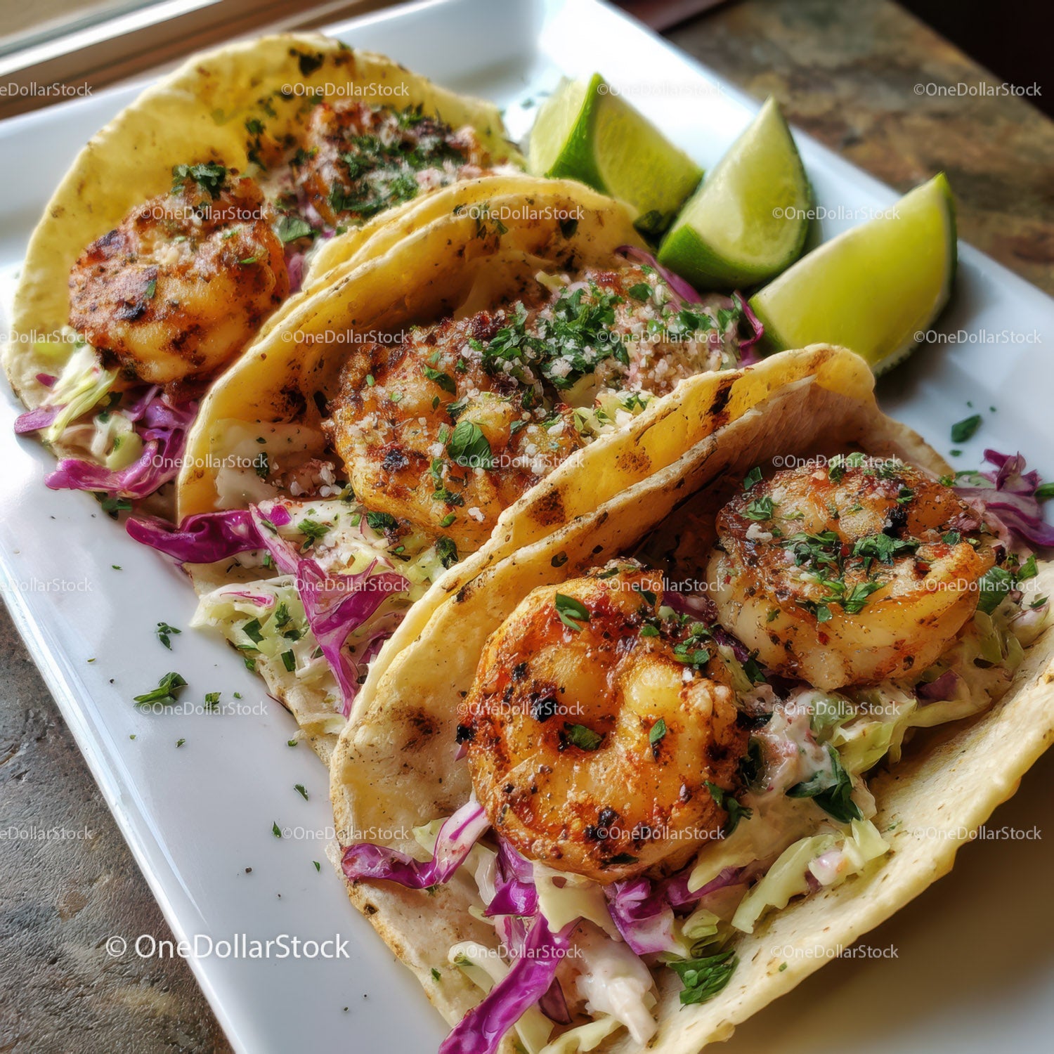 Shrimp Tacos with Lime and Cabbage Slaw in a Bright Plate