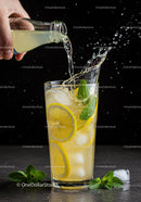Refreshing Lemon Mint Drink with Splash and Ice Cubes