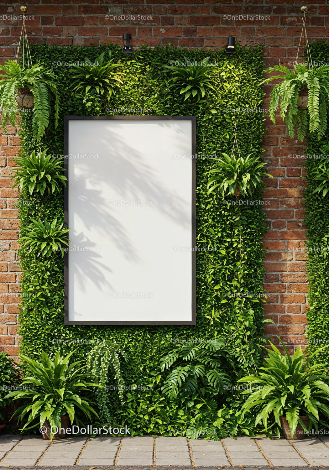Blank board surrounded by lush green plants on brick wall