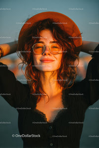 Smiling Woman Wearing Sunhat and Glasses in Outdoor Setting