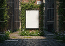 Blank poster on ivy-covered brick wall in cobblestone alley