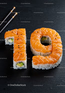 Creative sushi art shaped as number nineteen on black slate