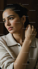 Elegant Woman Portrait with Natural Makeup and Stylish Earrings