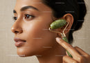 Close Up of Woman Using Jade Roller for Skin Rejuvenation