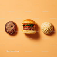 Gourmet Burger with Lettuce and Tomato Next to Grilled Steak and Dumpling