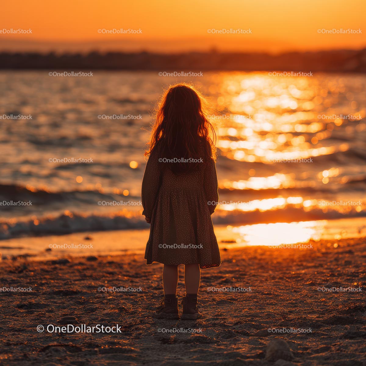 Silhouette of a Child at Sunset by the Ocean Shore