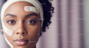 Close-up of a Woman Receiving Facial Skin Care Treatment with Patches